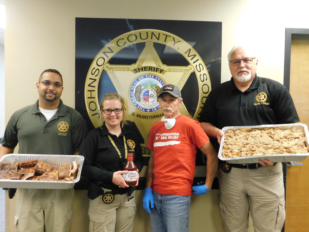 sheriff's office staff posing with food